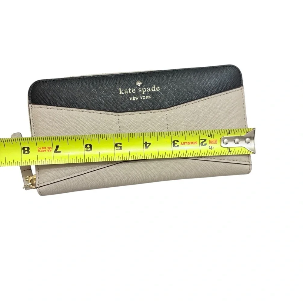 Kate spade cream and black saffiano leather bow wallet color block